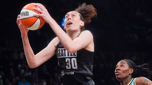 Breanna Stewart holding a basketball